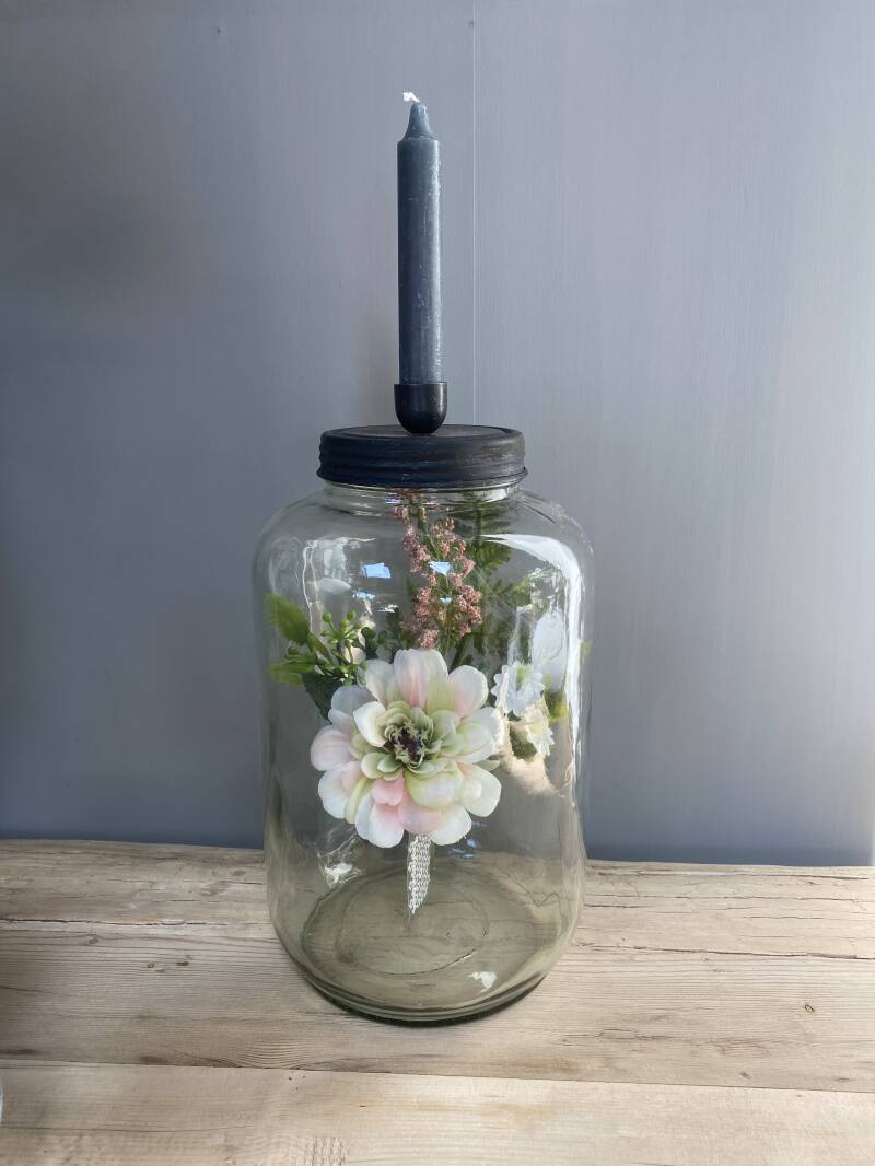 Glazen voorraadpot met kaarsenhouder in deksel